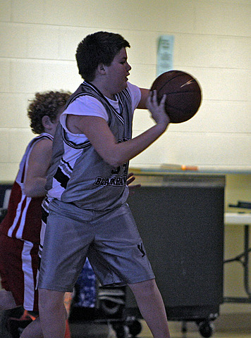 Andy playing basketball vs. Lourdes IMG_7360.jpg (103 k)